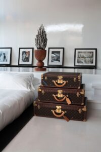 a couple of suitcases sitting on top of a white floor